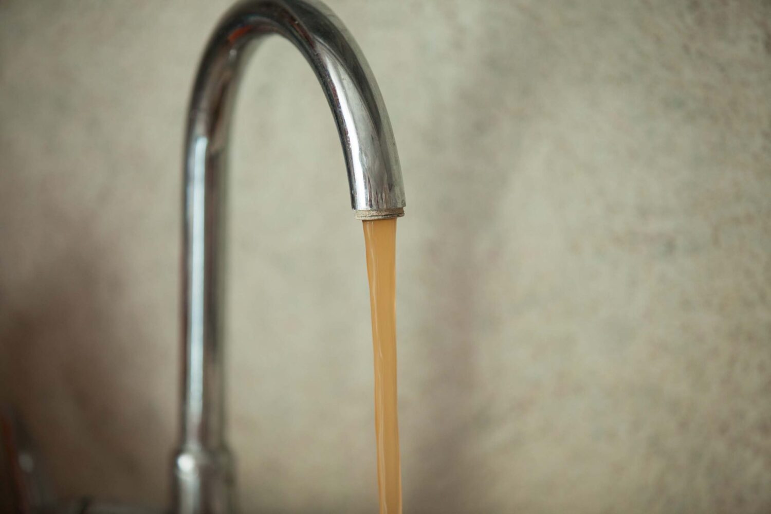 Dirty, Rusty Water Flows From The Tap