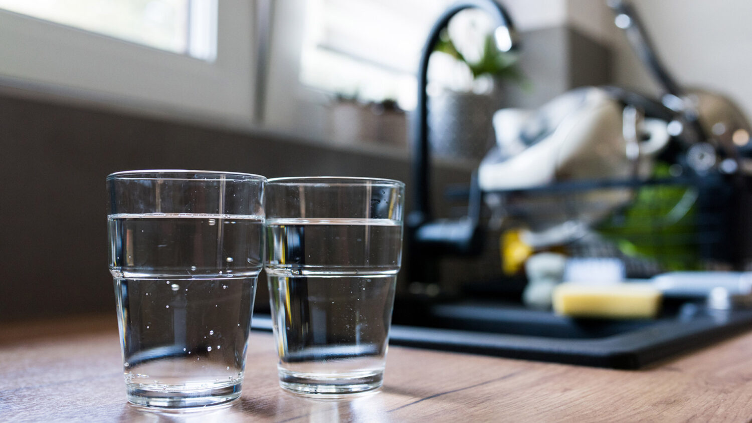 two glasses on kitchen counter of filtered water